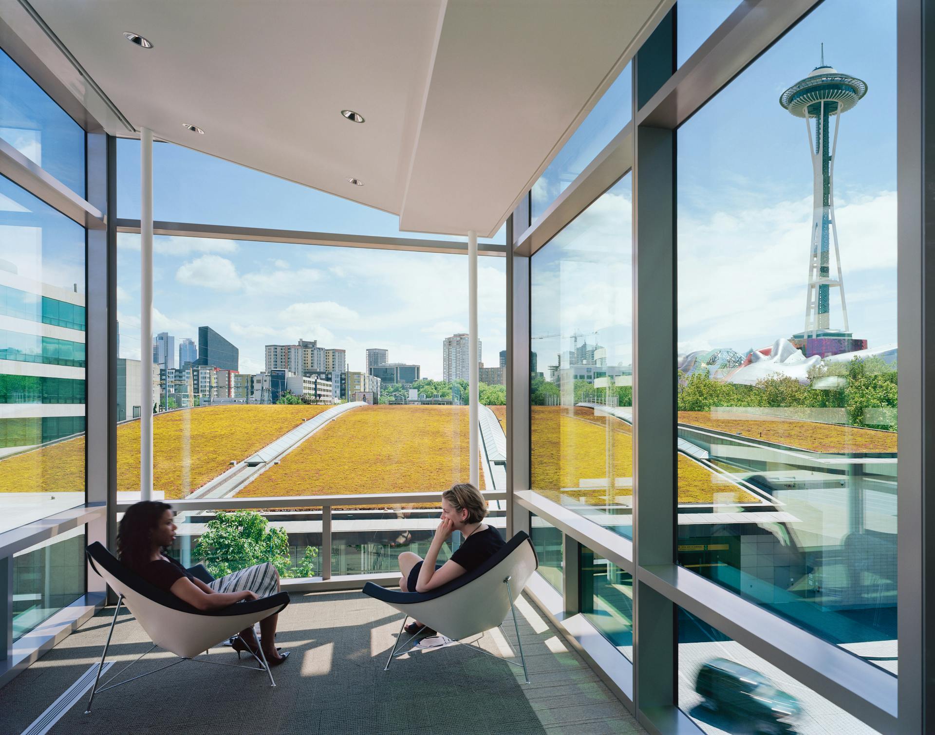 Informal meeting spaces at the end of each breezeway overlook downtown Seattle.,,,, Photographer: Timothy Hursley